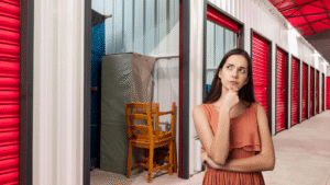 Woman choosing a self storage unit size inside a storage facility hallway
